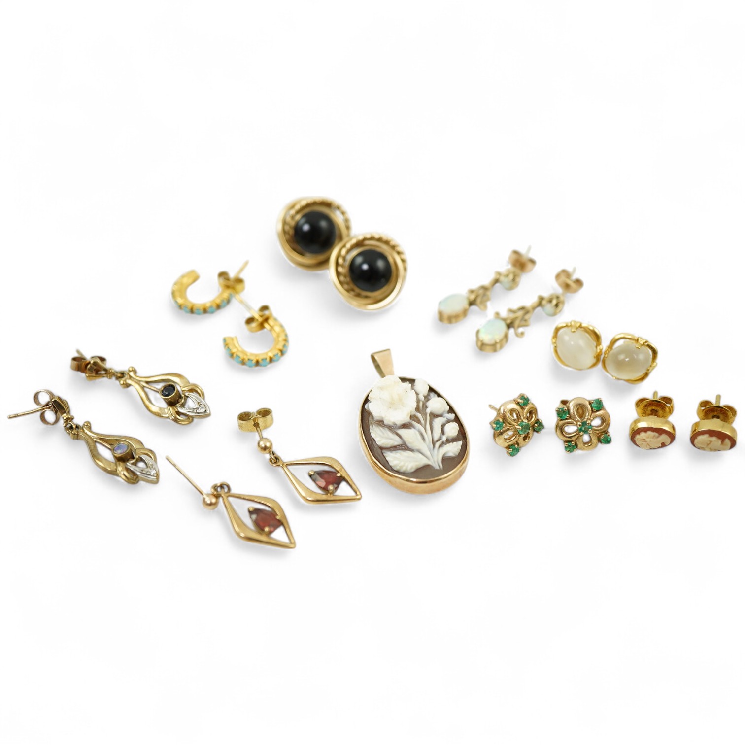 Eight pairs of earrings and pendant, comprising: a pair of onyx studs; a pair of emerald studs; a pair of sapphire and diamond drop earrings; a pair of opal drop earrings; a pair of garnet drop earrings; and a shell pend